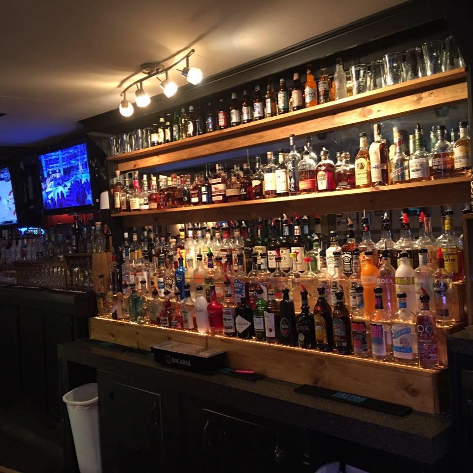 Rustic bar with wood accents and casual seating.